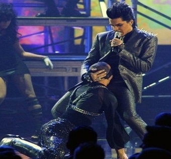 Adam Lambert Fakes a Blow Job Onstage, Kicks a Lady Between the Legs