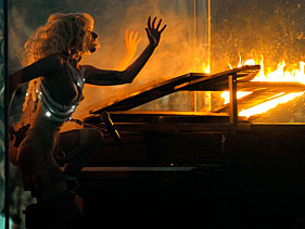 Lady Gaga Shatters Glass, Braves Flames At American Music Awards